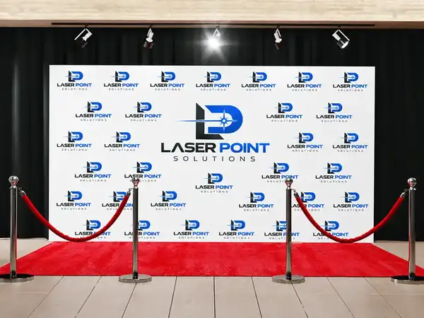 Laser Point Solutions step and repeat backdrop with red carpet entrance